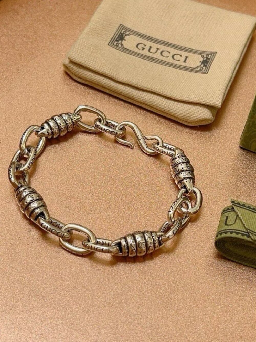 Gucci Silver Chain Bracelet with Engraved Logo Details